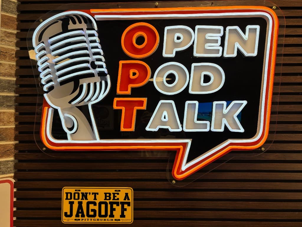 Studio accent wall with posters and signs behind the set